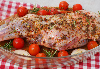 Fresh and raw meat. Leg of lamb on wood background