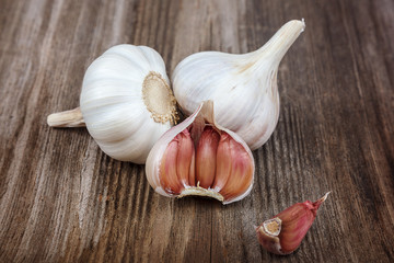 Fresh garlic on a wooden background