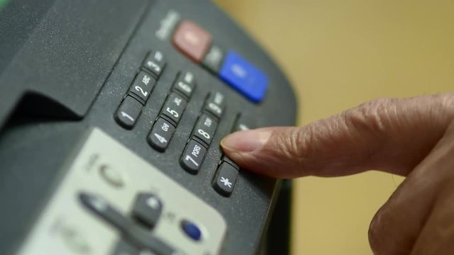 Elderly Man Dials The Numbers On MFP