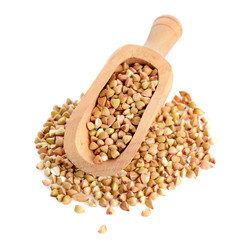Buckwheat in wooden scoop isolated on white background