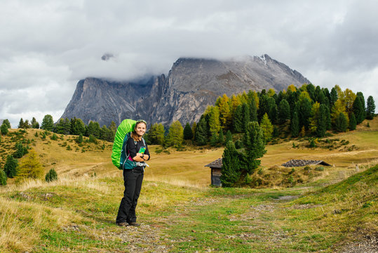 Trekker in Dolomite mountains, Italy