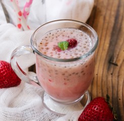 Strawberry Chia smoothie served in a glass mug, selective focus