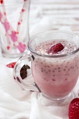 Strawberry Chia smoothie served in a glass mug, selective focus