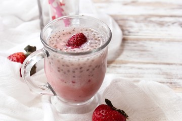 Strawberry Chia smoothie served in a glass mug, selective focus