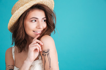 Close up portrait of a smiley young girl in straw hat