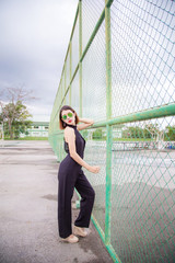 Fashion model Asian women Standing Poses and wear Black shirt. Short hair girl And wear sunglasses - 144861328