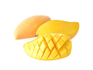 yellow mangoes on wooden background