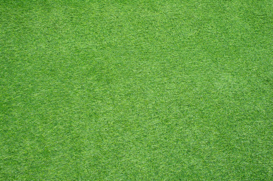 Soft focused picture of walkways cover by green artificial