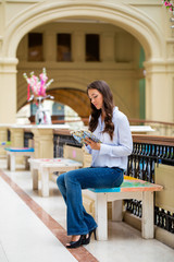 Young brunette woman with a notebook