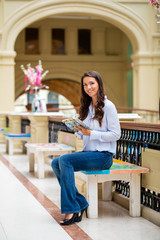 Young brunette woman with a notebook