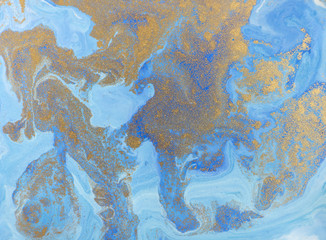 Blue and golden liquid texture. Watercolor hand drawn marbling illustration. Ink marble background.