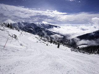 Fototapeta premium Landscape of Tatra lower mountain in winter time, with piste off Jasna Chopok ski resort.