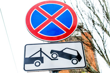 Parking is prohibited and the tow truck is working