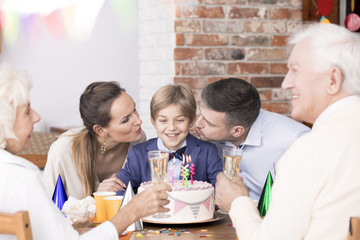 Boy celebrating birthday with family