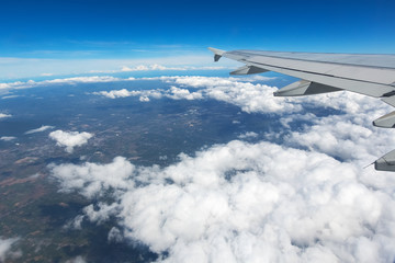 Obraz premium Above the clouds.Wing aircraft on the sky