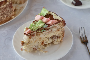 Delicious cake dessert with cream, walnuts and coffee