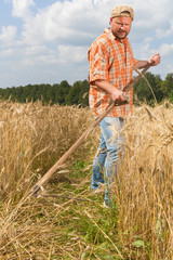 Modern farmer with scythe