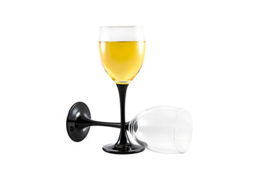 A glass of white wine and empty glass isolated on white.