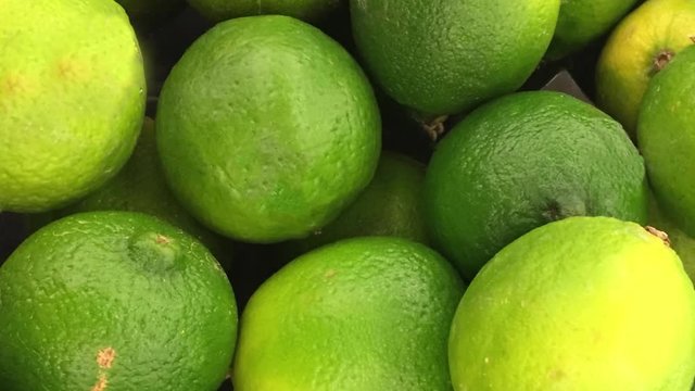 Closeup pan of limes
