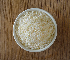 Japanese rice on wooden background