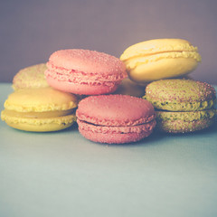Fototapeta na wymiar Pretty Pastel Colored French Macarons With Copy Space