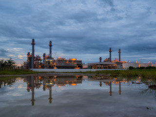 Fototapeta na wymiar power plant on sunset sky.