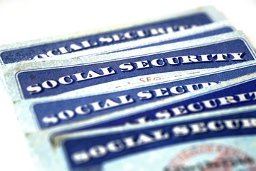 Social Security Cards in a Row Pile for Retirement