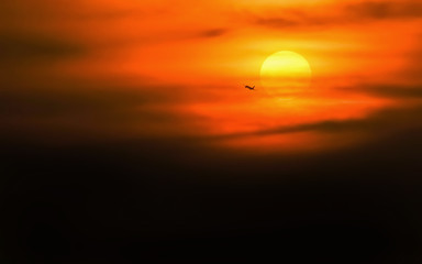 wild shot of silhouette Airplane with sunset in background