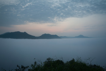 Fototapeta premium White clouds appearing before sunrise, Phu Tok Chiang Khan in Loei, Thailand.