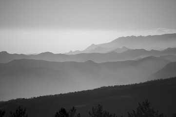 Mountains in sunrise light in black and white