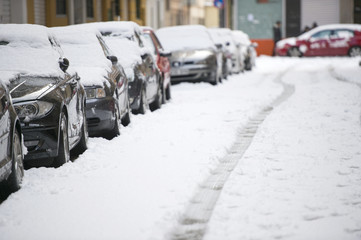 Parked cars after winter blizzard