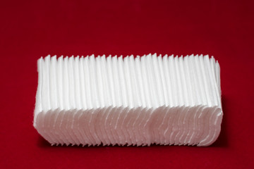 Cotton wool sheet, for cleansing face and red background