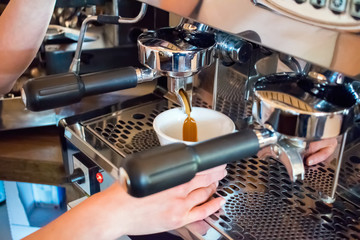 Espresso machine making coffee in pub, bar, restaurant