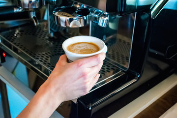 Fototapeta na wymiar Espresso machine making coffee in pub, bar, restaurant