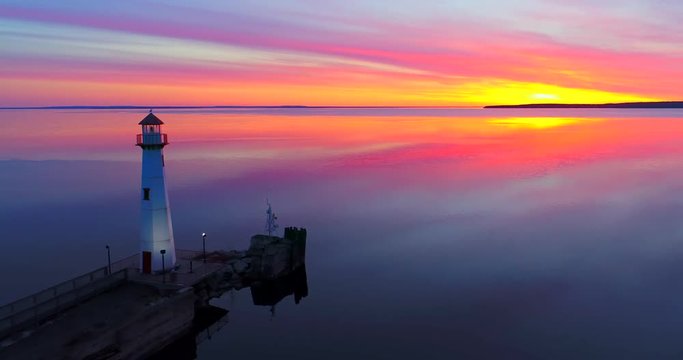 Wawatam Lighthouse in the stunning light of dawn, Saint Ignace, Upper Michigan. Scenic aerial flyby.