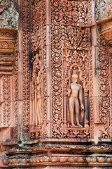 Carve of devata on the red sandstone walls in Banteay Srei, Siem reap, Cambodia.