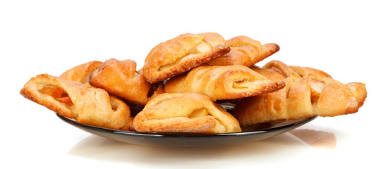 Buns with apple on a plate.