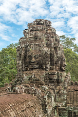 Fototapeta premium Giant face stone carving faces of Bayon temple in Angkor Thom, Siemreap, Cambodia