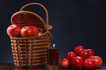  Red apples in a basket and apple juice