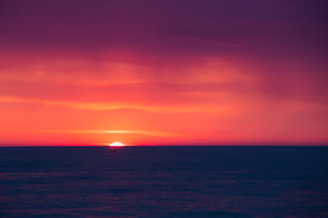 Natural Purple Color Sunset Or Sunrise Sky Over Sea After Storm 