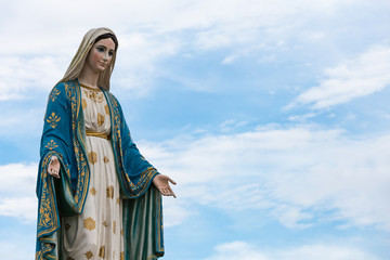 The Blessed Virgin Mary in the blue sky.