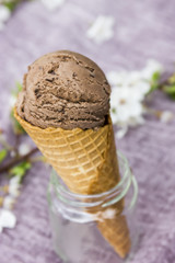 Ice-cream in a waffle horn. White, chocolate, strawberry