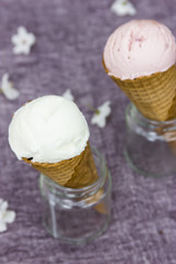 Ice-cream in a waffle horn. White, chocolate, strawberry