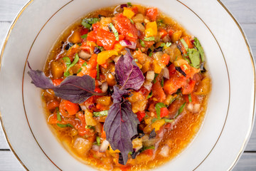 Grilled Vegetables salad. Eggplant, tomatoes, pepper, onion, herbs. Top view with selective focus