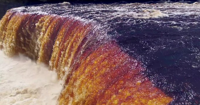Springtime waterfall raging in Upper Michigan, this is upper Tahquamenon Falls, aerial view.