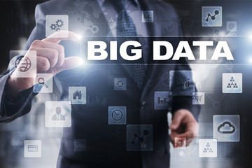 Businessman selecting big data on virtual screen.