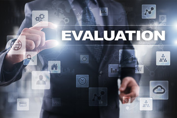 Businessman selecting evaluation on virtual screen.
