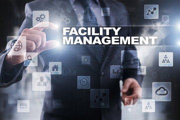 Fototapeta na wymiar Businessman selecting facility management on virtual screen.