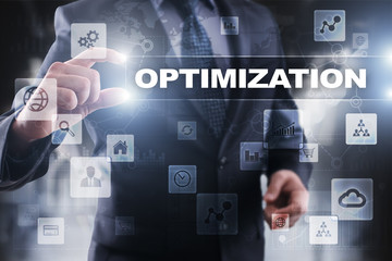 Fototapeta premium Businessman selecting optimization on virtual screen.