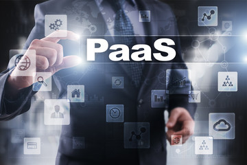 Businessman selecting paas on virtual screen.